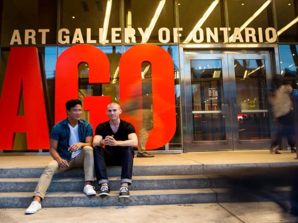Two men sitting in front of the AGO