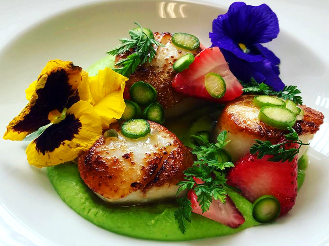 A plate full of colourful and appetizing food